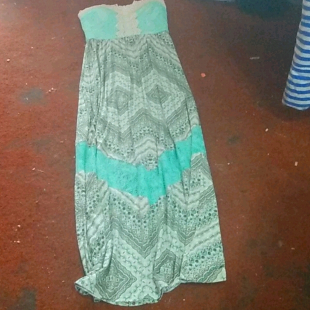 A teal and brown sleeveless dress